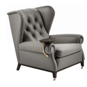 POLTRONA FRAU Tufted leather armchair with armrests