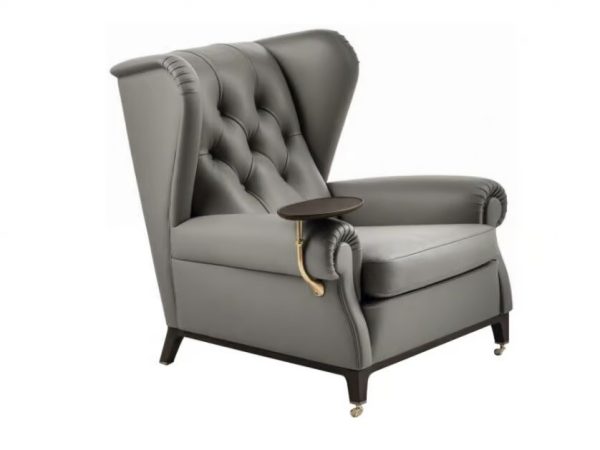 POLTRONA FRAU Tufted leather armchair with armrests